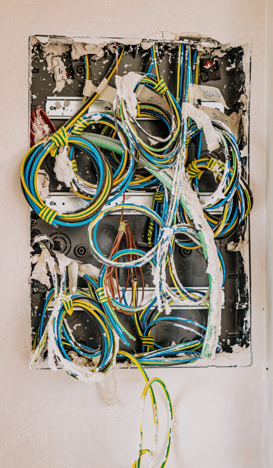 wires exposed in an open hole in a wall