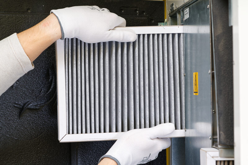 Replacing dirty air filter for home central air conditioning system
