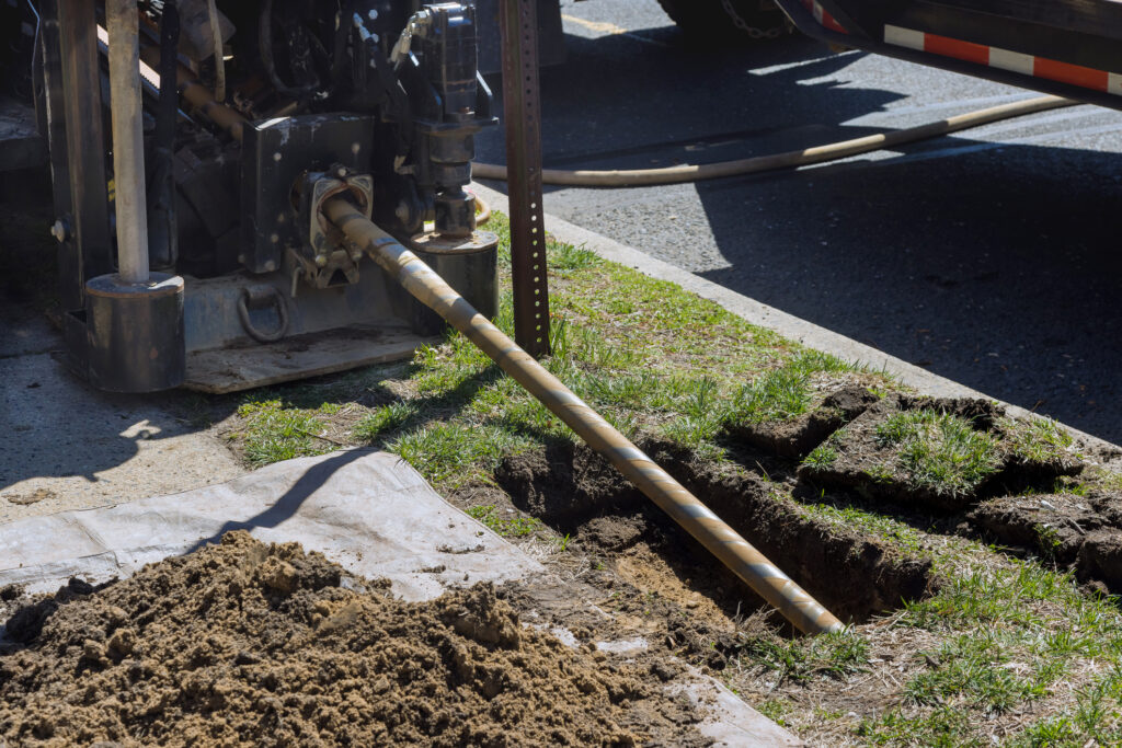 Low-angle view of trenchless sewer replacement 
