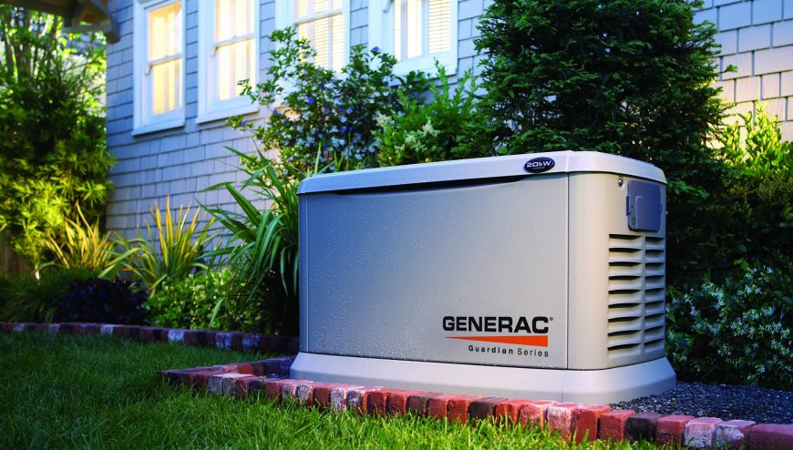 Generac generator in front of a house on a patio with plants around it
