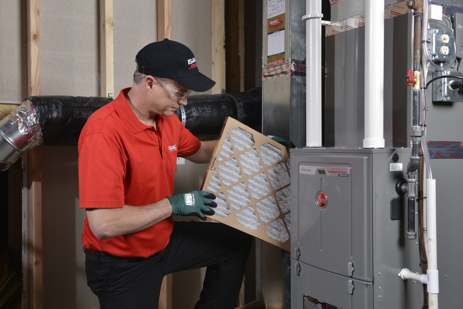 Isaac technician repairing a home furnace