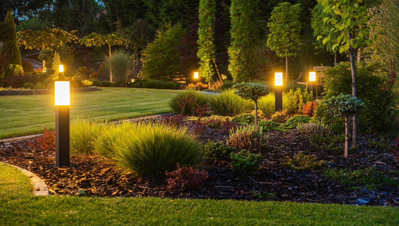 Panoramic Photo of LED Light Posts Illuminated Backyard Garden During Night Hours